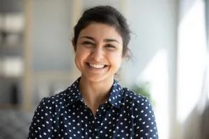 Patient smiling after cosmetic care