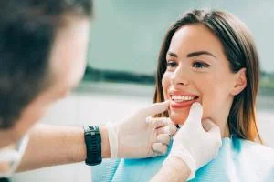 Clinician examining the chewing surfaces of a patient's teeth