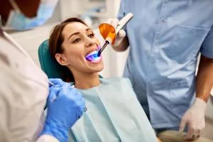 Clinician applying a protective dental treatment