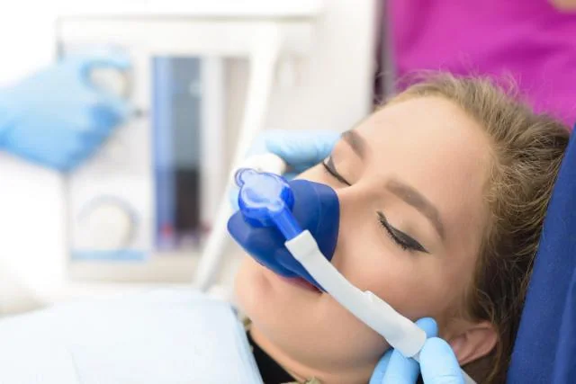 Patient receiving conscious sedation during dental care