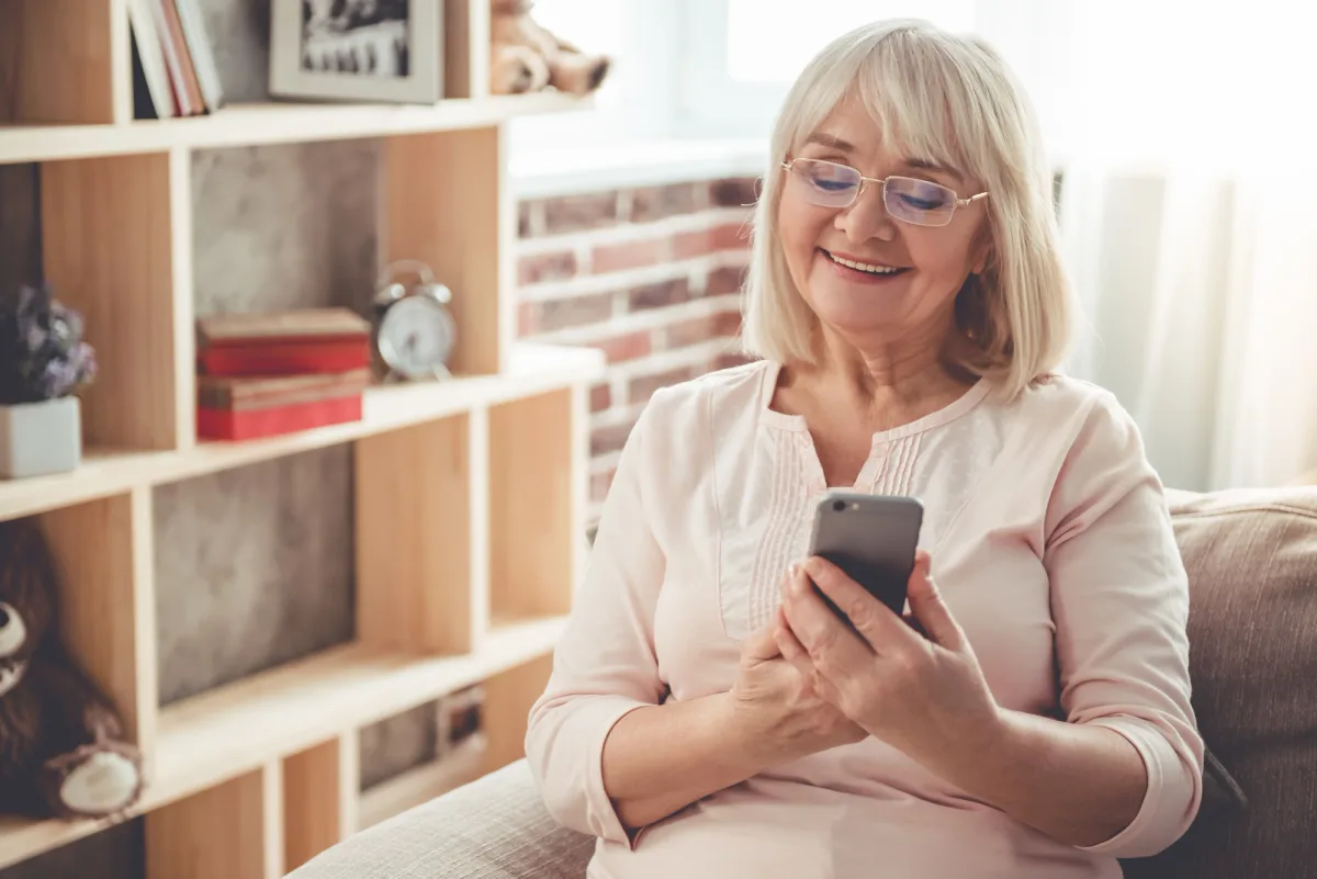 Patient reviewing dental financing options on her phone